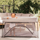Baby in a Go With Me Nod Deluxe Portable Travel Crib