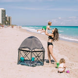 Baby-in-playard-with-mom-and-sister